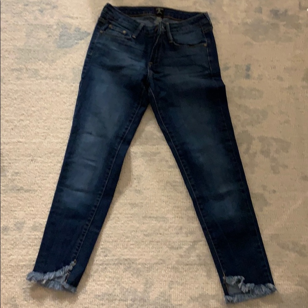 Just black blue jeans with frayed bottom